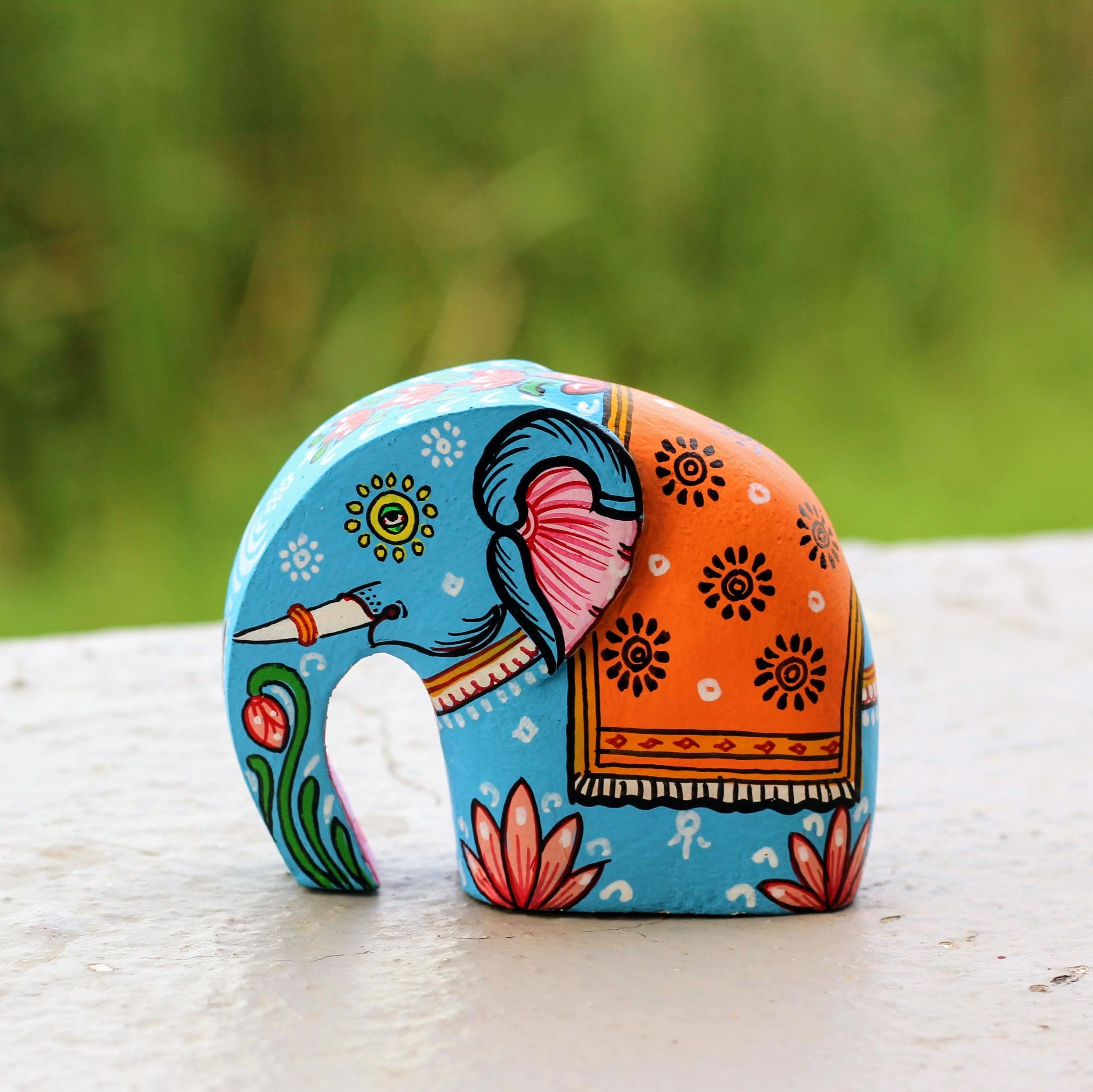 Colorful elephant-shaped object on a natural background