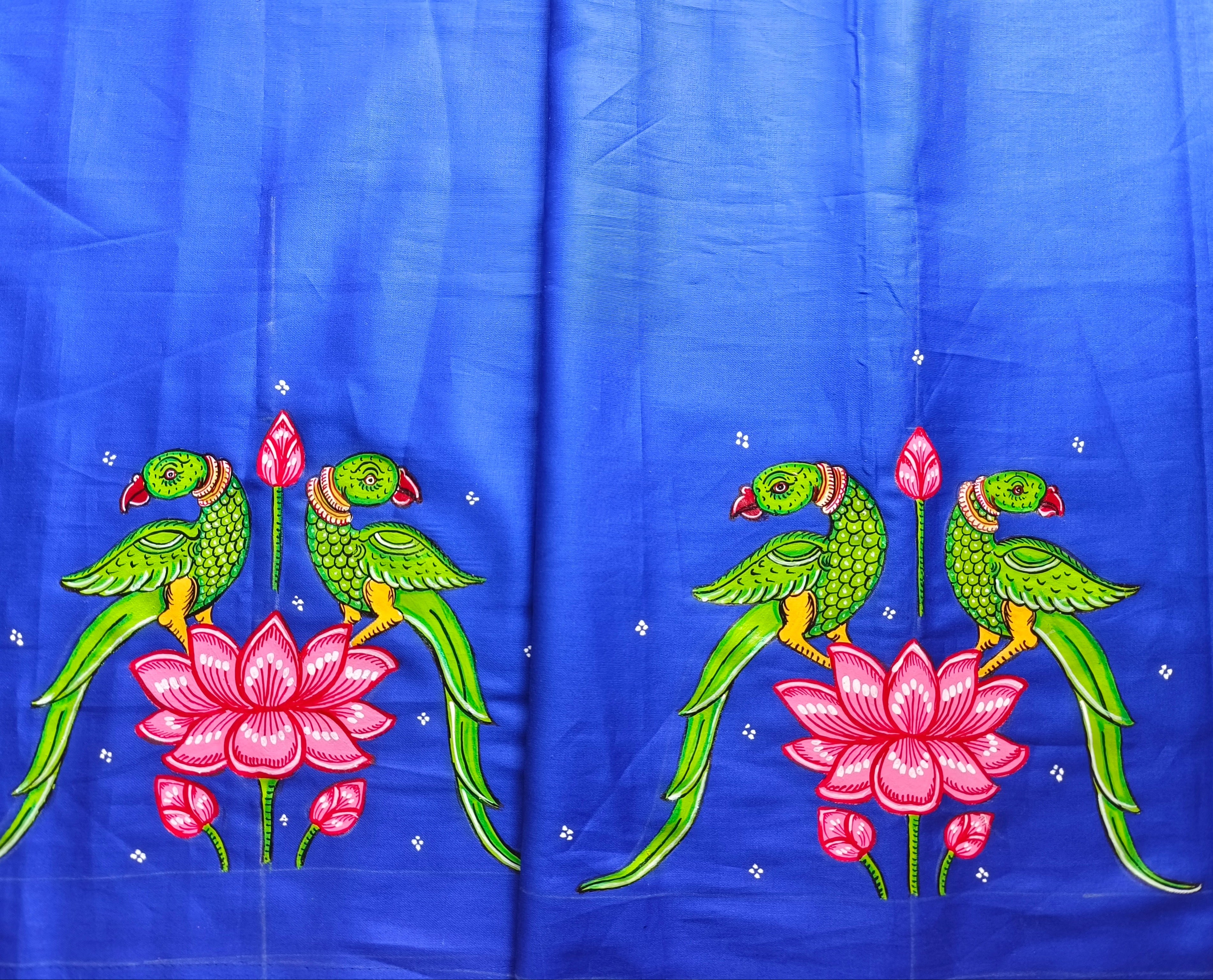 Embroidered fabric with parrots and lotus flowers on a blue background