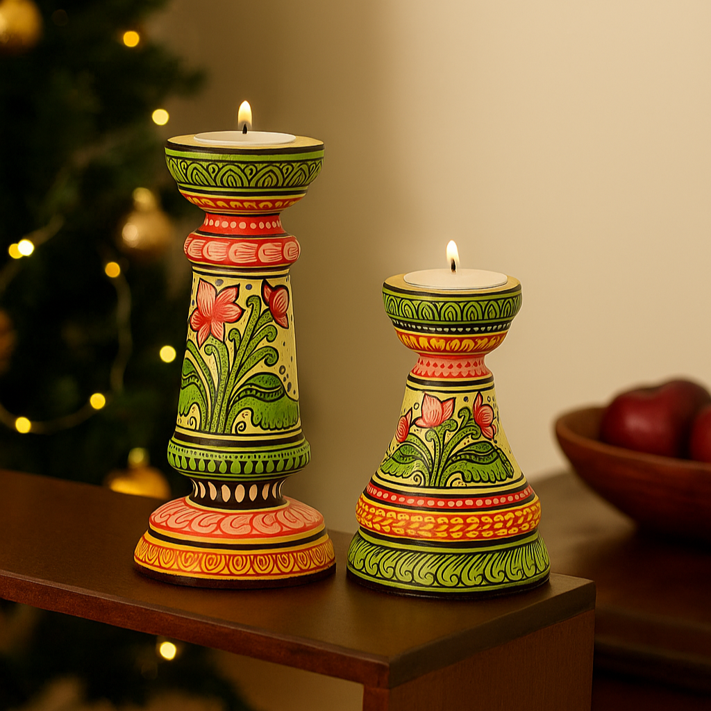 Decorative candle holders with floral patterns on a table with a blurred background

