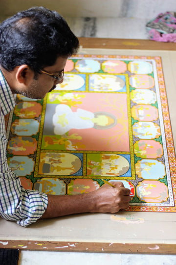 A man painting pattachitra