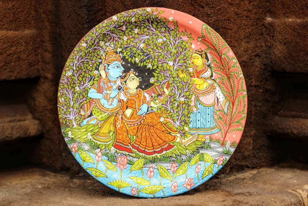 Hand-painted Pattachitra Radha Krishna In Jungle Wall Plate by Maavni