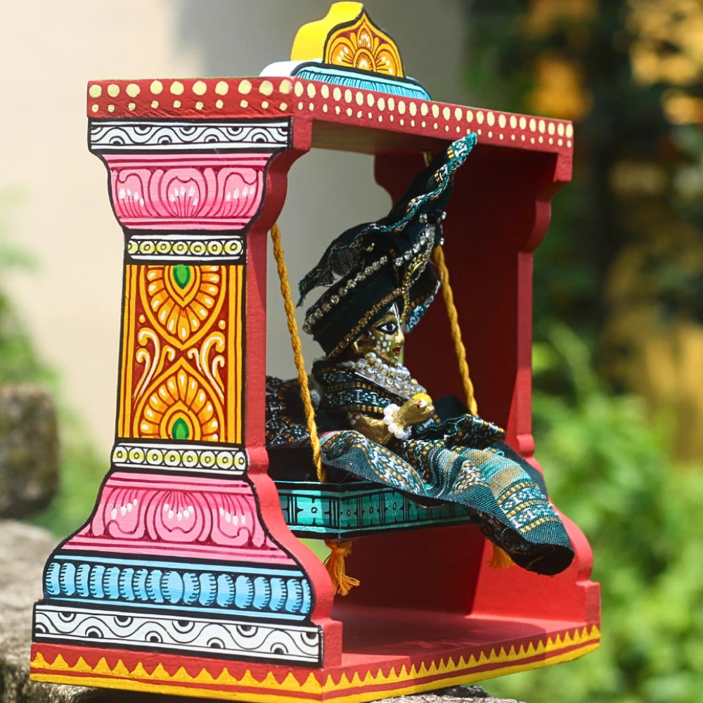 Hand-painted Pattachitra Hand Painted Wooden Krishna Jhula Festive Decor gallery image by Maavni