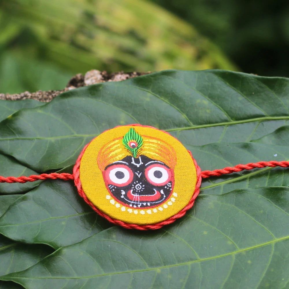 Hand-painted Pattachitra Handpaintedjaganathyellowrakhi Festive Decor by Maavni