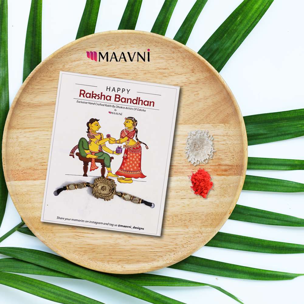 Hand-painted Pattachitra Dhokra Rakhi Festive Decor gallery image by Maavni