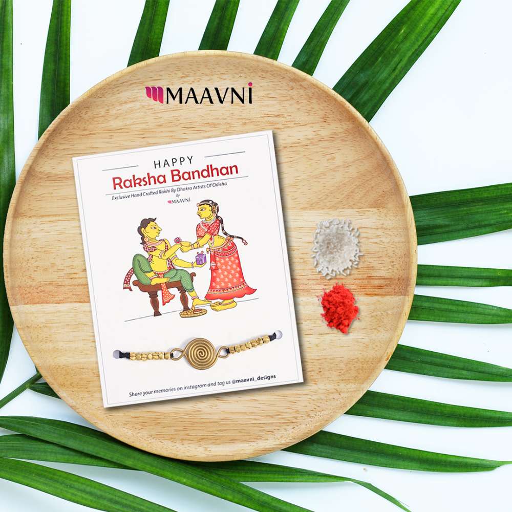 Hand-painted Pattachitra Dhokra Rakhi Festive Decor gallery image by Maavni