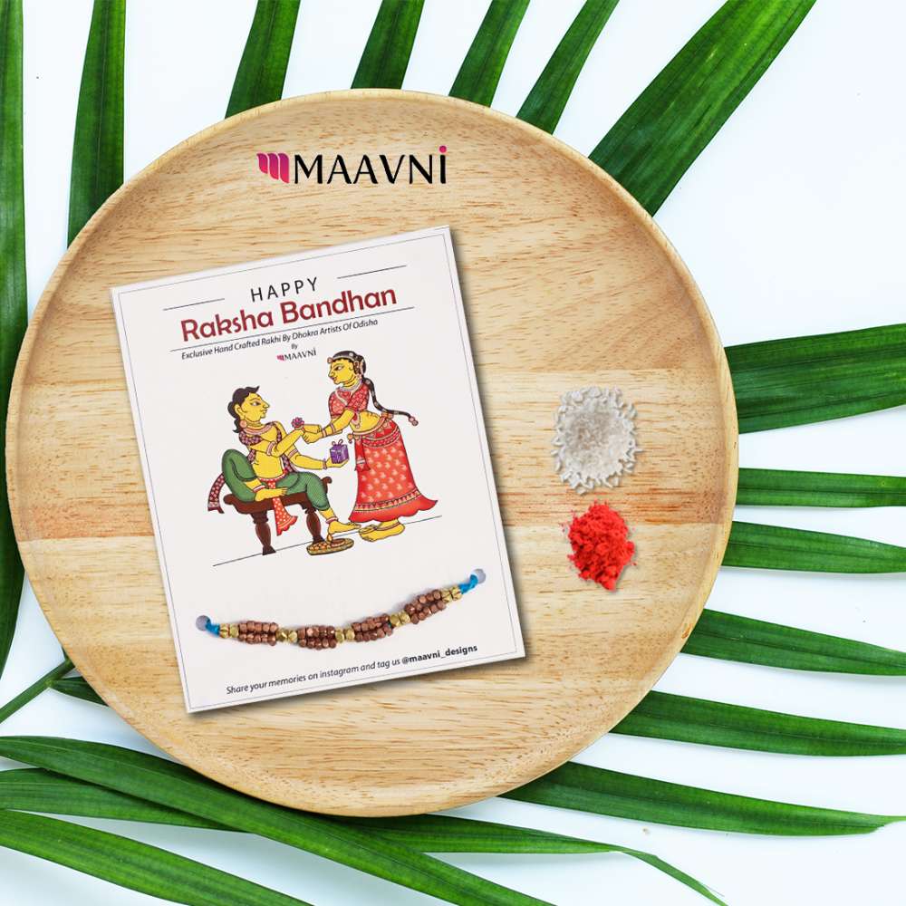 Hand-painted Pattachitra Dhokra Rakhi Festive Decor gallery image by Maavni