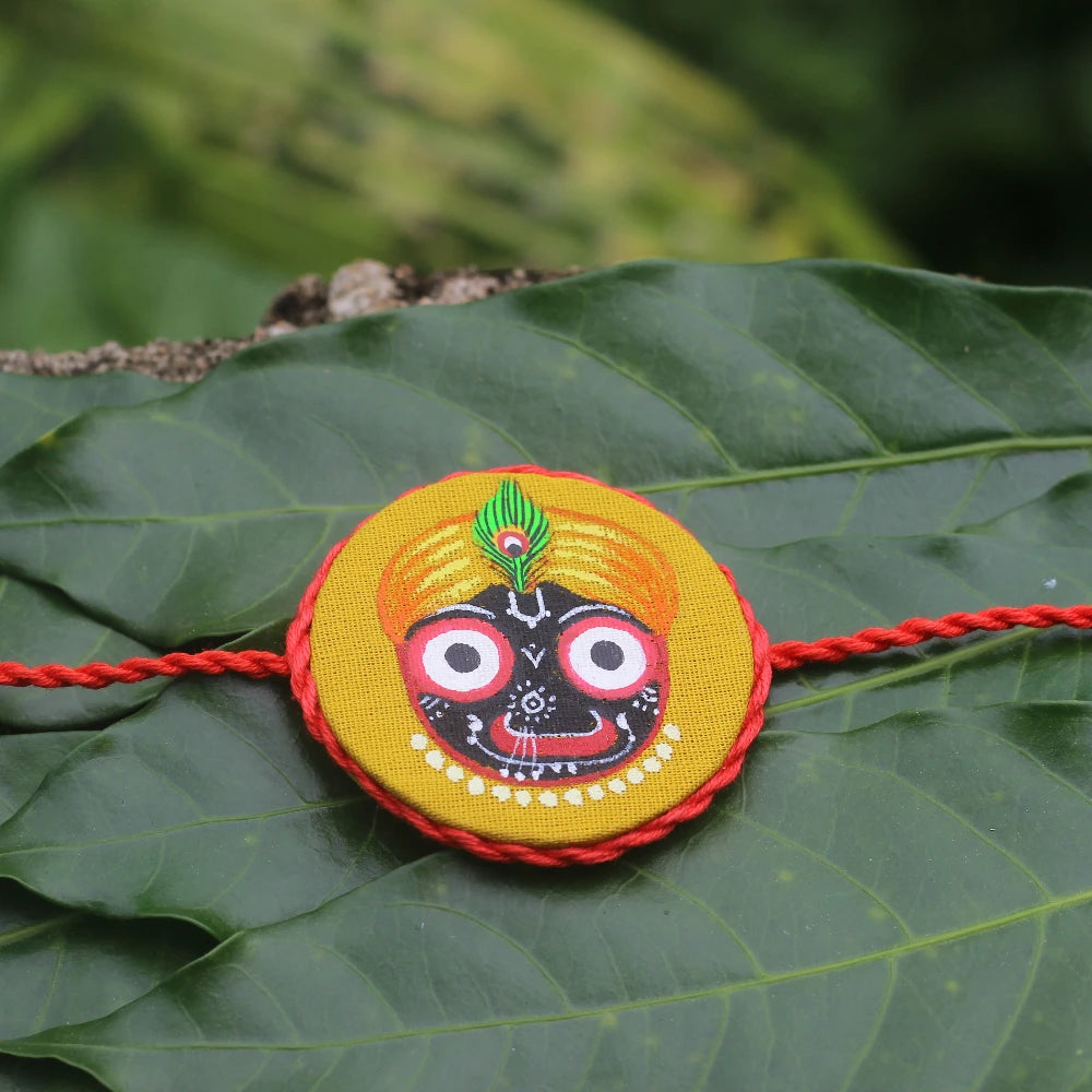 Hand-painted Pattachitra Handpaintedjaganathyellowrakhi Festive Decor by Maavni